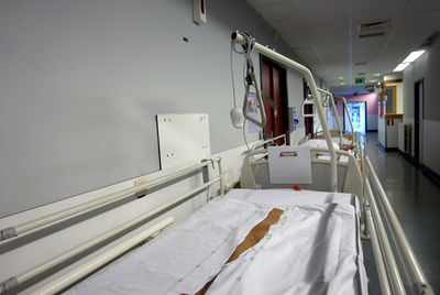 Bed in hospital corridor