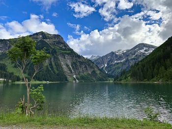 Scenic view of lake and mountains against sky