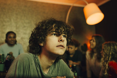 Portrait of young man looking away