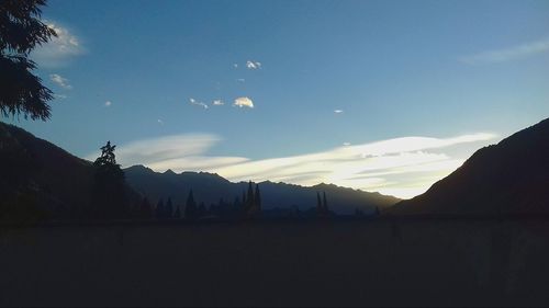 Scenic view of silhouette mountains against sky
