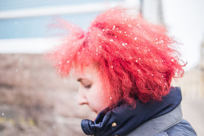 Close-up of woman with red hair during winter