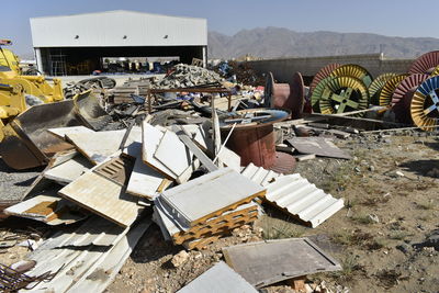 Stack of garbage by metal structure