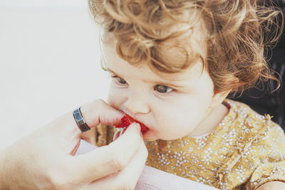 Close-up portrait of a girl holding ice cream
