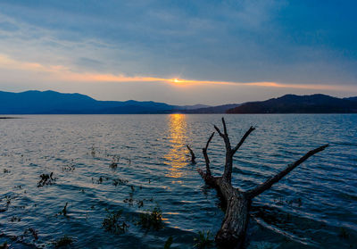 Scenic view of lake against sky during sunset