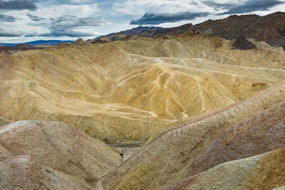 Scenic view of barren landscape against sky