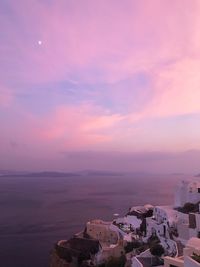 High angle view of bay against sky at sunset