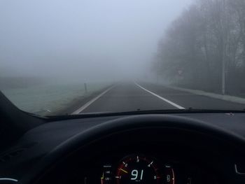 Cropped image of car on road