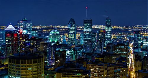 Illuminated buildings in city at night