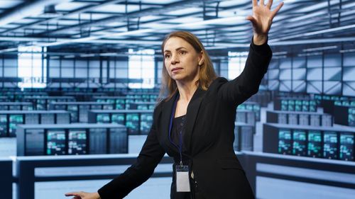 Portrait of young woman standing in office