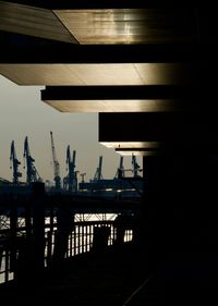 Silhouette of pier against sky