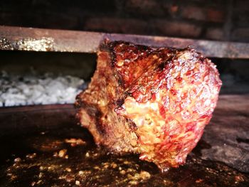 Close-up of meat on barbecue grill