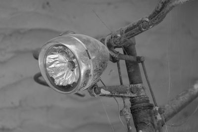 Close-up of headlight on abandoned bicycle