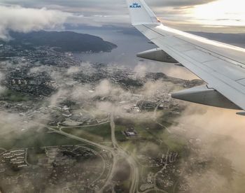 Aerial view of airplane flying in sky