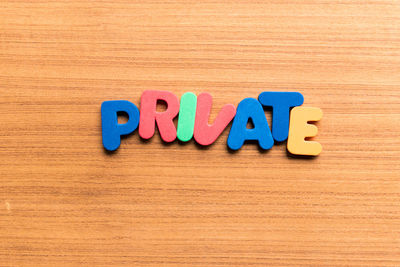 Close-up of multi colored pencils on wooden table