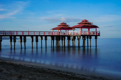 Pier over sea against sky