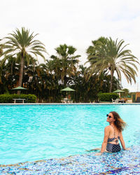 Young woman swimming in pool