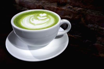 Close-up of coffee cup on table