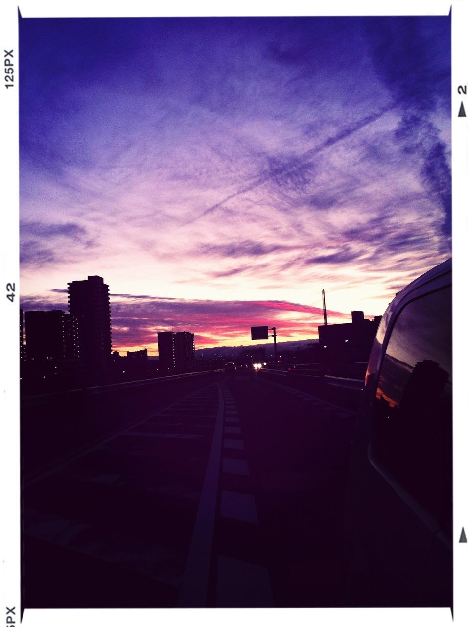 transfer print, sky, sunset, auto post production filter, transportation, cloud - sky, silhouette, architecture, built structure, cloud, building exterior, dusk, road, cloudy, orange color, car, no people, outdoors, mode of transport, city