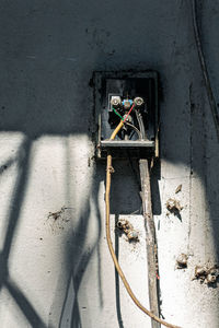 Abandoned shopping cart on wall