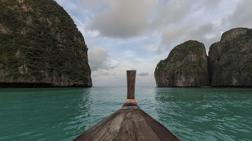 Panoramic view of sea and mountains against sky