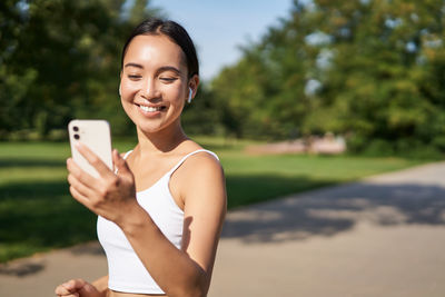 Young woman using mobile phone