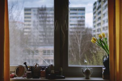 Close-up of vase on window sill