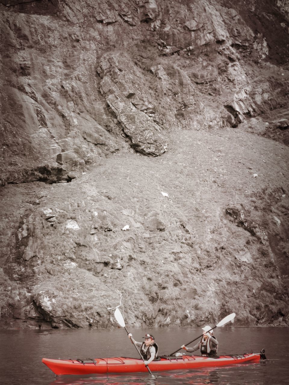 HIGH ANGLE VIEW OF PEOPLE ENJOYING ON ROCK