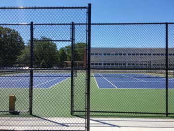 Chainlink fence against blue sky