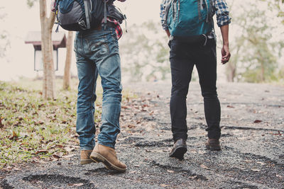 Low section of people standing on land