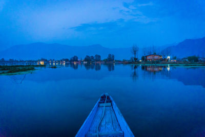 Scenic view of lake against sky at dusk