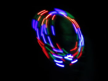 Close-up of light trails against black background