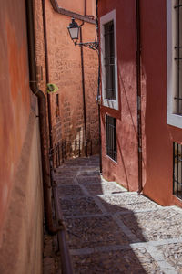 Footpath amidst buildings in town