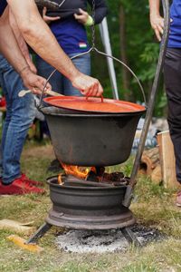 Midsection of man preparing food
