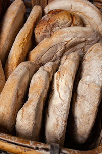 Basket of baked bread with wood oven