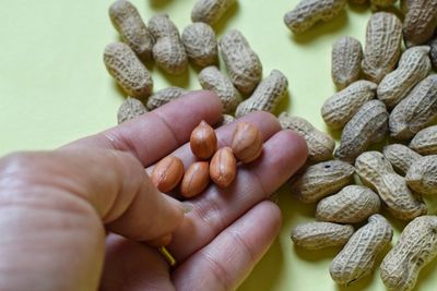 Close-up of hand holding eggs