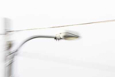 Close-up of electric lamp against white background