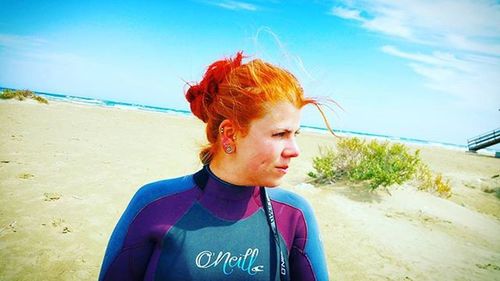 Portrait of woman standing on beach