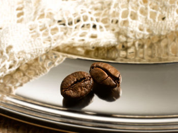 Close-up of coffee beans on table