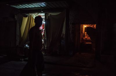 Rear view of man standing in building