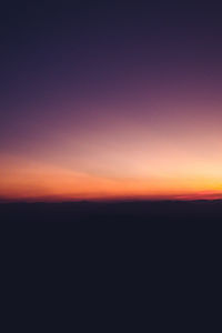 Scenic view of silhouette landscape against sky during sunset
