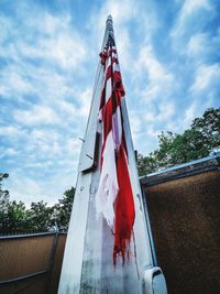 Low angle view of flag against sky