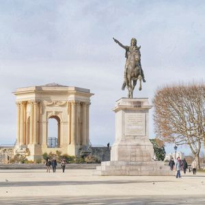 Statue in front of historical building