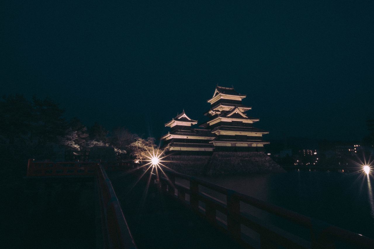 VIEW OF ILLUMINATED BUILDING AT NIGHT