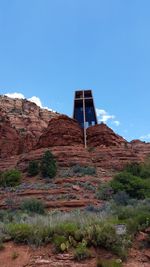 Low angle view of built structure against clear blue sky