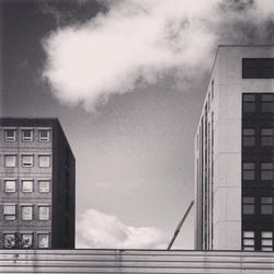 Low angle view of building against cloudy sky