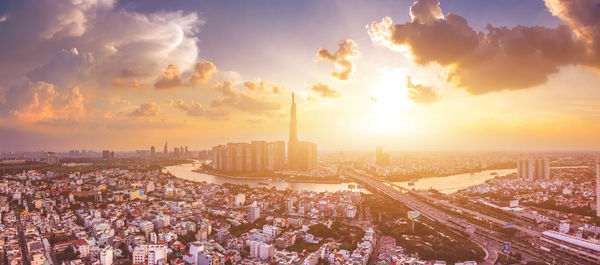 Panoramic view of city against sky during sunset