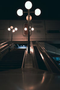 Low angle view of illuminated escalator