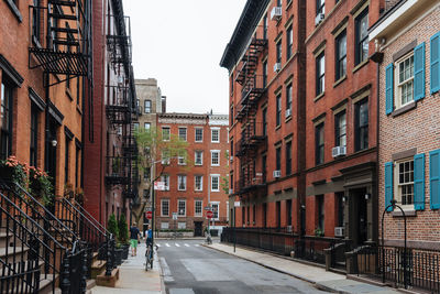 Street amidst buildings against sky