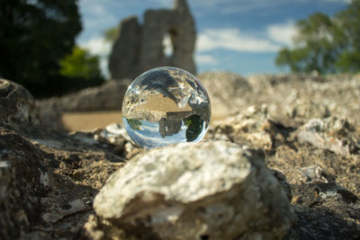 Close-up of crystal ball on rock