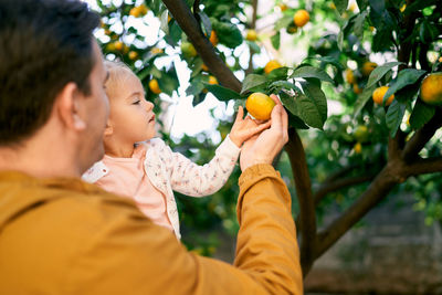 Woman holding oranges